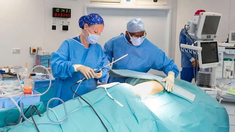 Elena Prousskaia in the surgical theatre with an assistant surgeon. They are using state-of-the-art facilities.