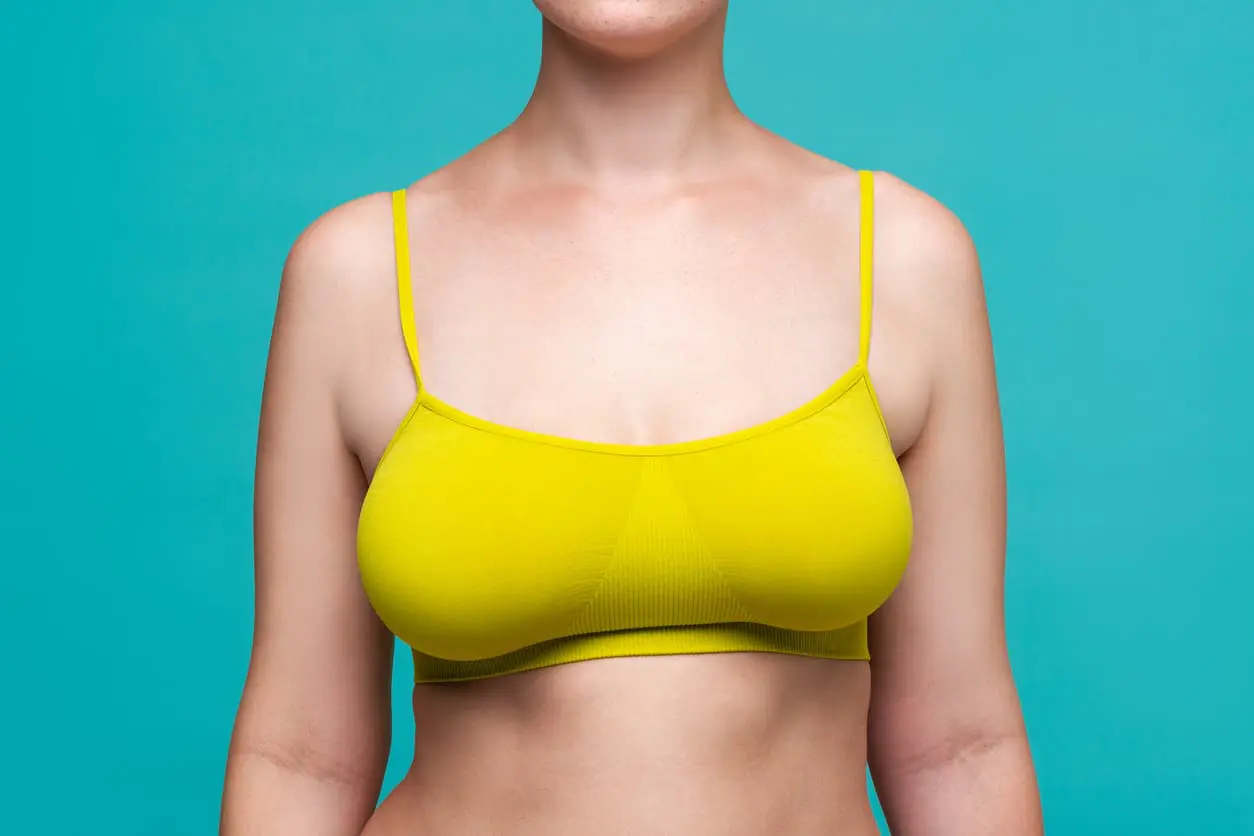 a woman with large but moderately asymmetrical breasts 