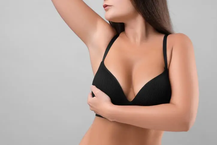 Lady in a bra after having breast surgery