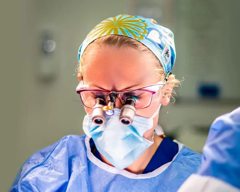 Mrs Elena Prousskaia, consultant plastic surgeon, operating during breast surgery in Bristol